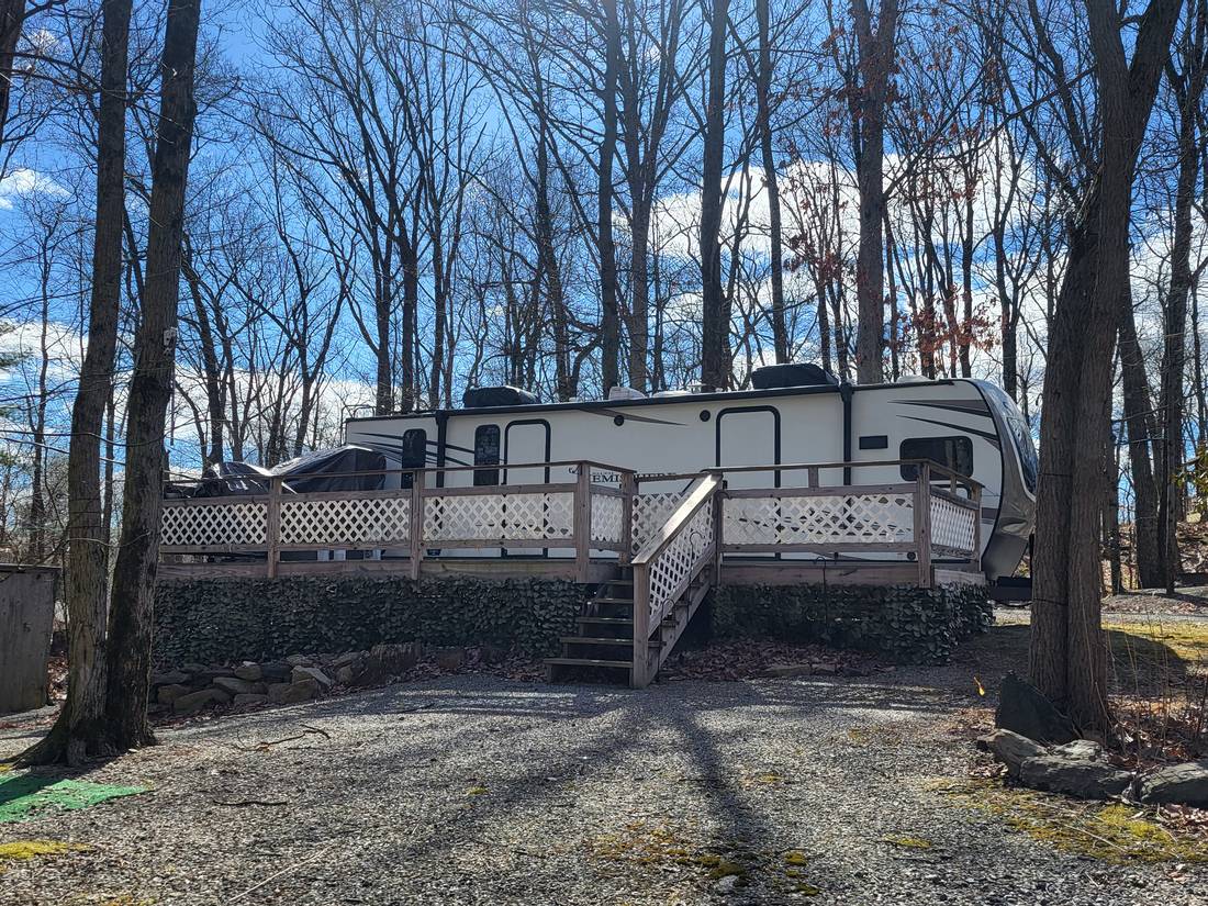 Wooded RV site with deck at Rosemount